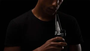 A man holding an electric dab rig