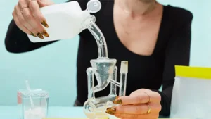 A woman is cleaning a dab rig