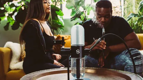 A woman and a man are smoking