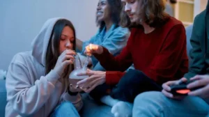 There are three people smoking
