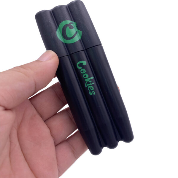 cookies-plastic-joint-holder-tube-1 A hand holding a cookies plastic joint holder tube